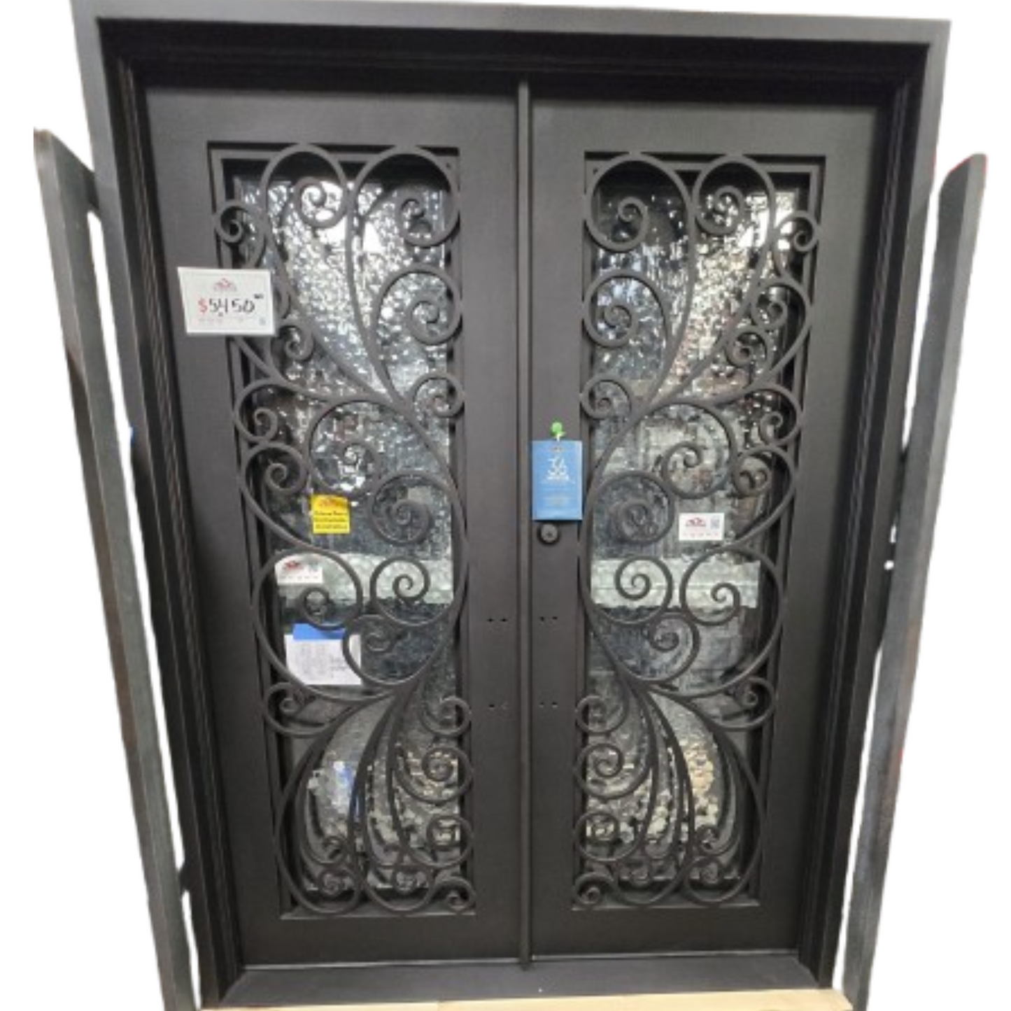 Decorative wrought iron double door with intricate designs