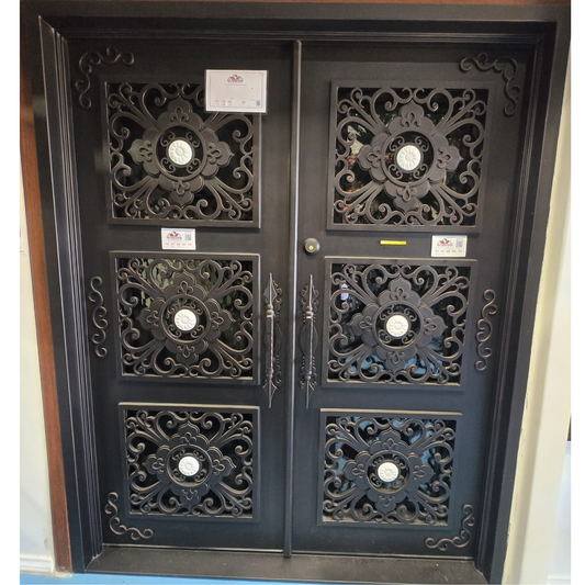 Decorative black iron door with intricate designs