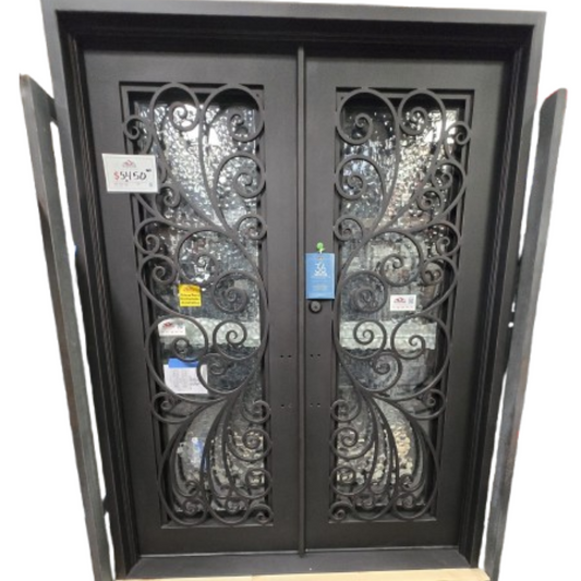 Decorative wrought iron double door with intricate designs