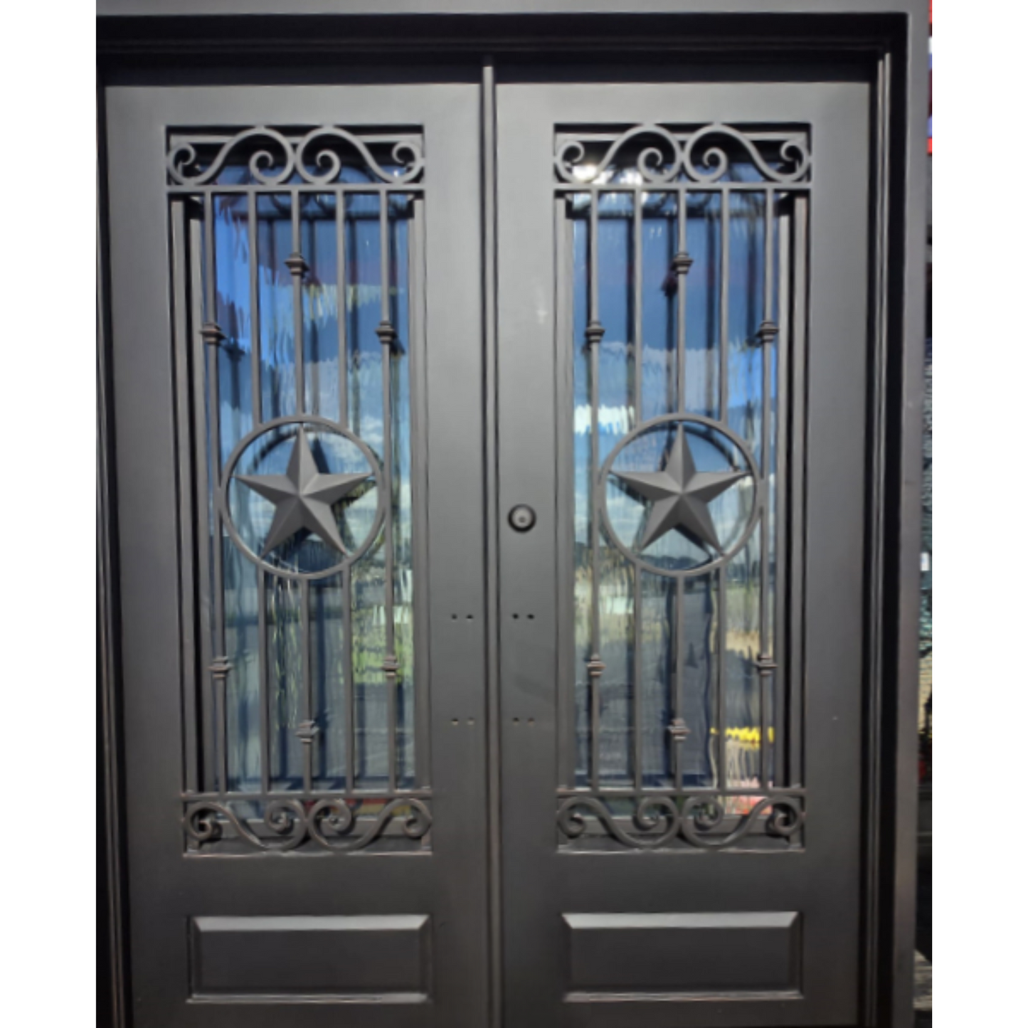 Double iron door with decorative metal grills and star designs